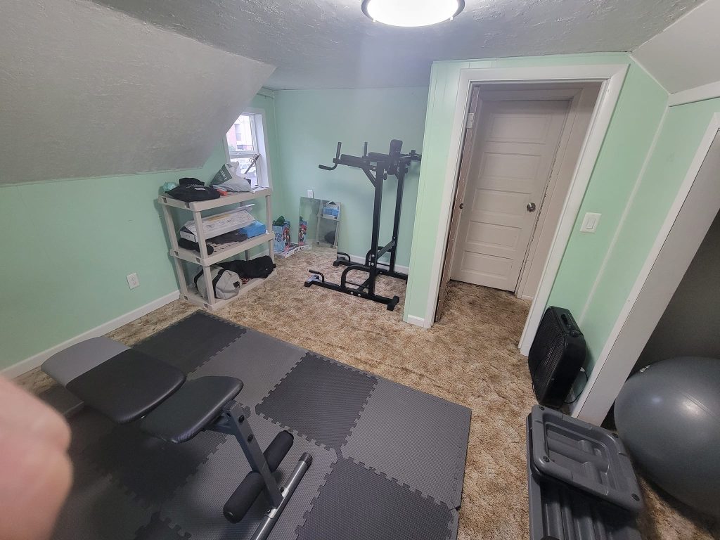 A photo of a gym in a spare bedroom